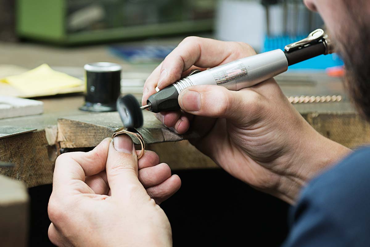 Goldsmith Polishing a Ring