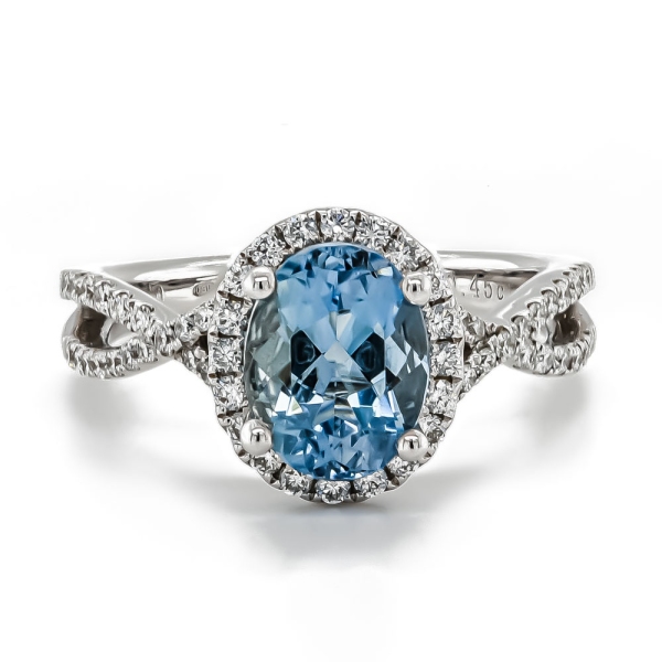 18ct White Gold Oval Aquamarine with Diamond Surround and Diamond Twist Shoulders Ring